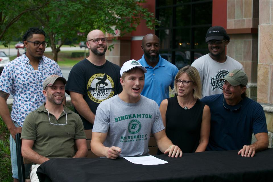 Lincoln wrestler Cayden Bevis ('22) singed a National Letter of Intent to wrestle with Binghamton University this fall on June 28, 2022, at BJ's Brewhouse.