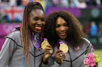 Gold medalists <a href="http://sports.yahoo.com/olympics/tennis/serena-williams-1131104/" data-ylk="slk:Serena Williams;elm:context_link;itc:0;sec:content-canvas" class="link ">Serena Williams</a> of the United States and <a href="http://sports.yahoo.com/olympics/tennis/venus-williams-1131109/" data-ylk="slk:Venus Williams;elm:context_link;itc:0;sec:content-canvas" class="link ">Venus Williams</a> of the United States celebrate during the medal ceremony for the Women's Doubles Tennis on Day 9 of the London 2012 Olympic Games at the All England Lawn Tennis and Croquet Club on August 5, 2012 in London, England. (Photo by Clive Brunskill/Getty Images)