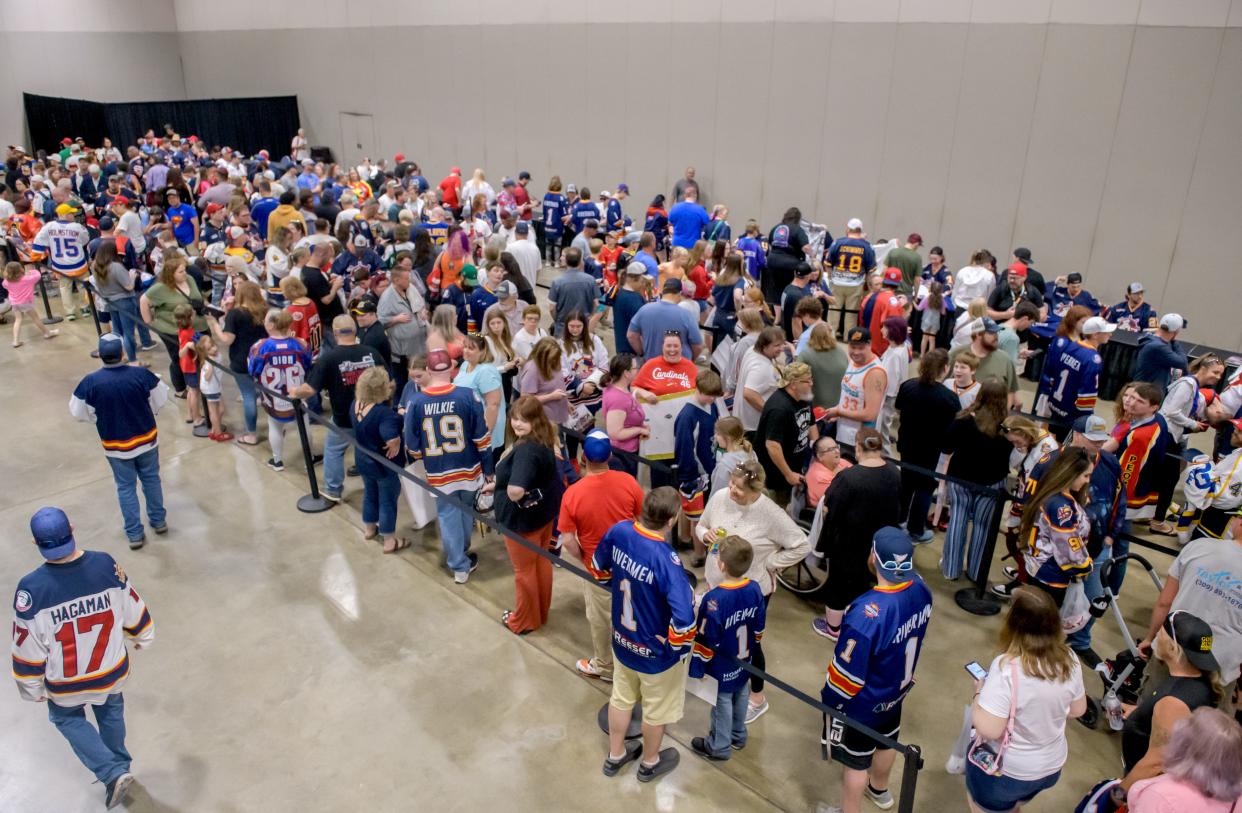 A large crowd lines up for autographs from the Peoria Rivermen during a public celebration for the team's SPHL President's Cup championship Friday, May 3, 2024 at the Peoria Civic Center.