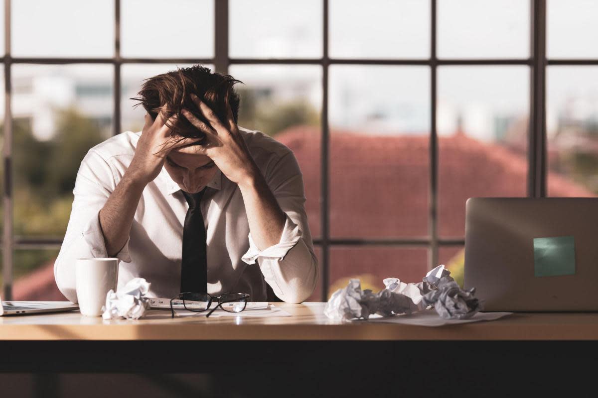 A generic photo of man stressed at work. See PA Feature WELLBEING Immersive Coaching. Picture credit should read: Alamy/PA. WARNING: This picture must only be used to accompany PA Feature WELLBEING Immersive Coaching..