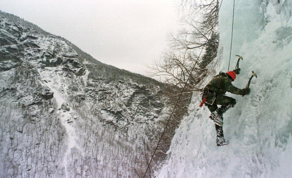 A soldier climbs a steep, ice-covered cliff in Smugglers Notch in Cambridge, Vt., Wednesday, Jan. 20, 1999. The two-week Vermont National Guard Mountain Warfare School teaches soldiers how to survive the cold and deal with the mountainous terrain they might encounter in real world warfare.
