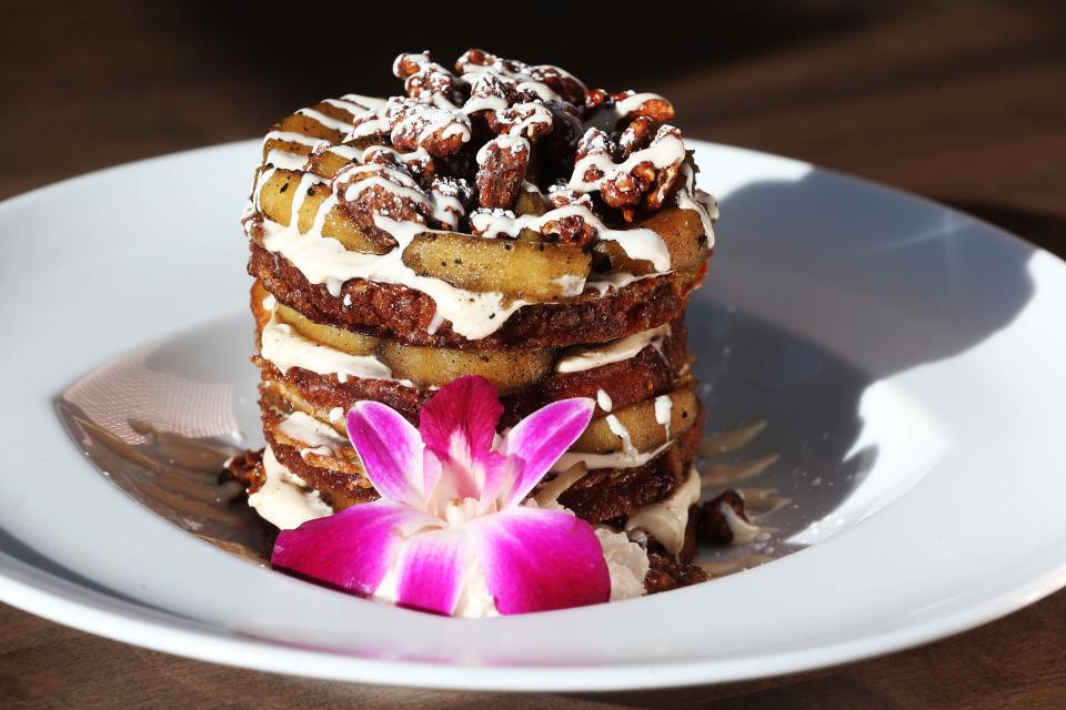 The French toast stack at Golden Nest Pancakes & Cafe in Wauwatosa is made with cinnamon bread and is layered with roasted apples, cream cheese icing and candied pecans.