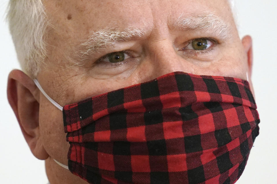Minnesota Gov. Tim Walz wears his buffalo plaid cloth mask during questions at a press conference to announce statewide mask mandate, Wednesday, July 22, 2020, to help slow the spread of COVID-19. (Anthony Souffle/Star Tribune via AP)