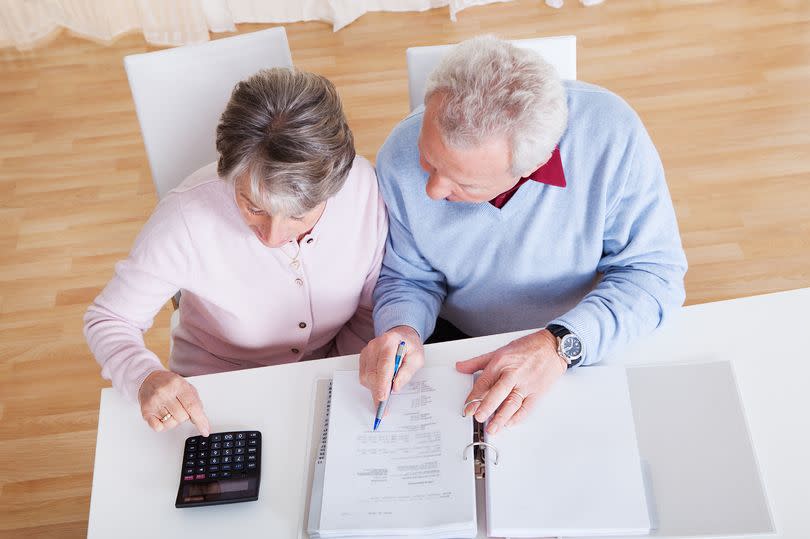 A pension-age couple working out their finances