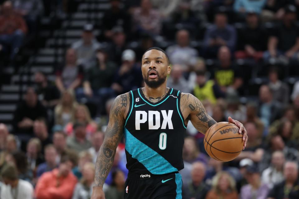 Portland Trail Blazers guard Damian Lillard (0) brings the ball up the court during a March 22, 2023 game.