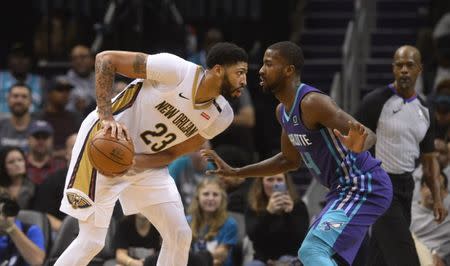 Dec 2, 2018; Charlotte, NC, USA; New Orleans Pelicans forward center Anthony Davis (23) looks to pass as he is defended by Charlotte Hornets forward Michael Kidd-Gilchrist (14) during the second half at the Spectrum Center. Pelicans won 119-109. Mandatory Credit: Sam Sharpe-USA TODAY Sports