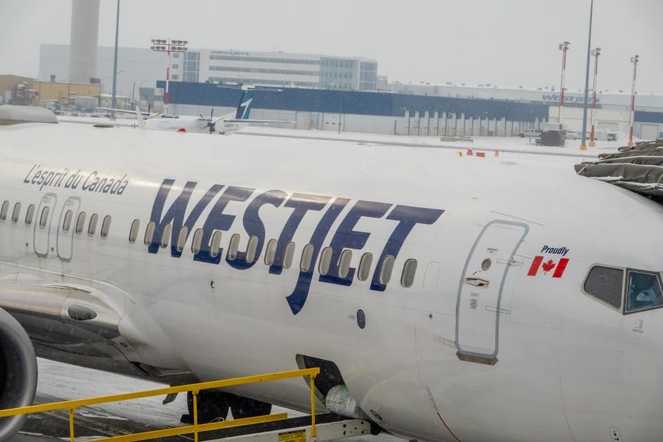 Calgary, Alberta, Canada. Mar 27, 2024. A close up to a Westjet logo on a plane.