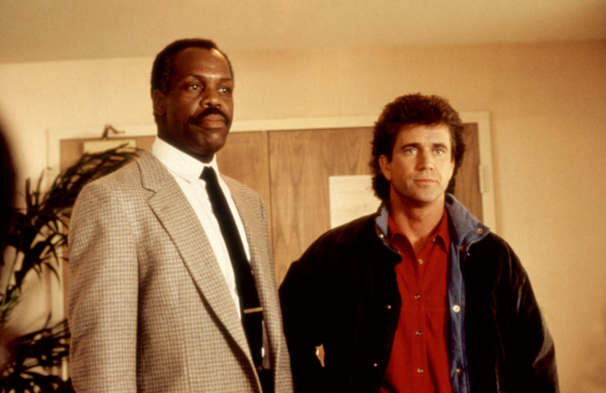 Murtaugh and Riggs (Danny Glover and Mel Gibson) team up for the first time in Lethal Weapon, which celebrates its 35th anniversary this year. (Photo: Warner Bros/Courtesy Everett Collection)
