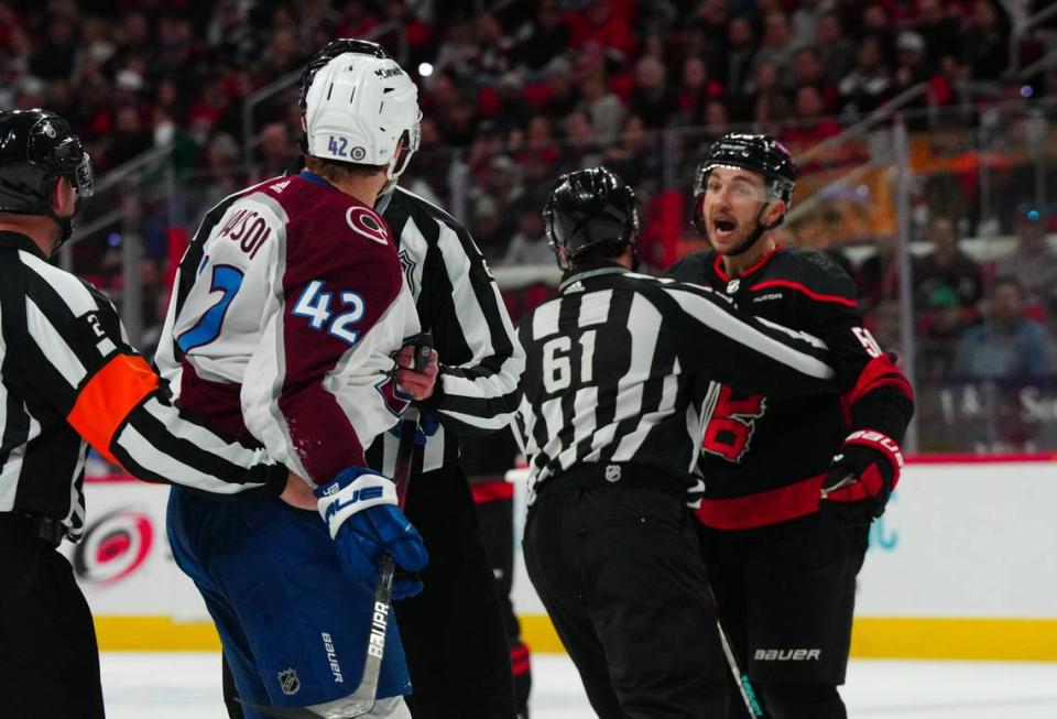 Carolina Hurricanes left wing Michael Bunting (58) and Colorado Avalanche defenseman Josh Manson (42) reacts during the second period at PNC Arena.