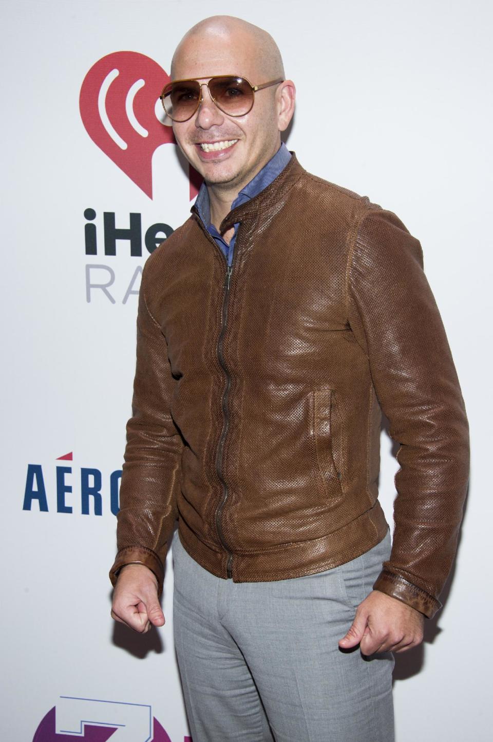 Pitbull attends Z100's Jingle Ball presented by Aeropostale on Friday, Dec. 13, 2013, in New York. (Photo by Charles Sykes/Invision/AP)