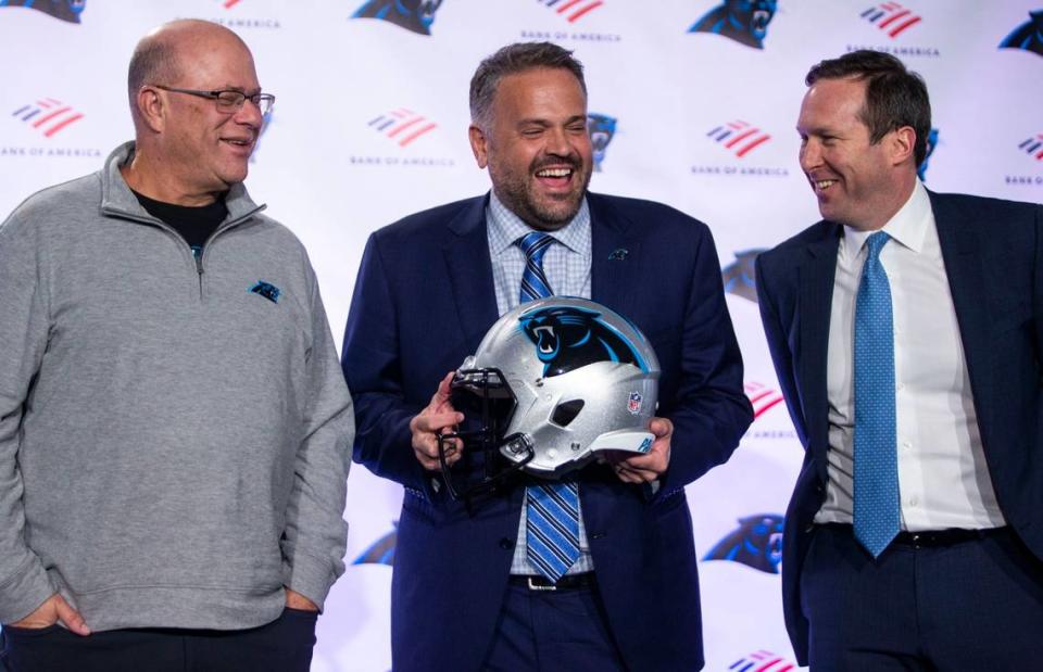 From left, Panthers owner David Tepper, head coach Matt Rhule and former team president Tom Glick exchange laughs before Rhule was introduced as Carolina’s new head coach on Jan. 8, 2020.