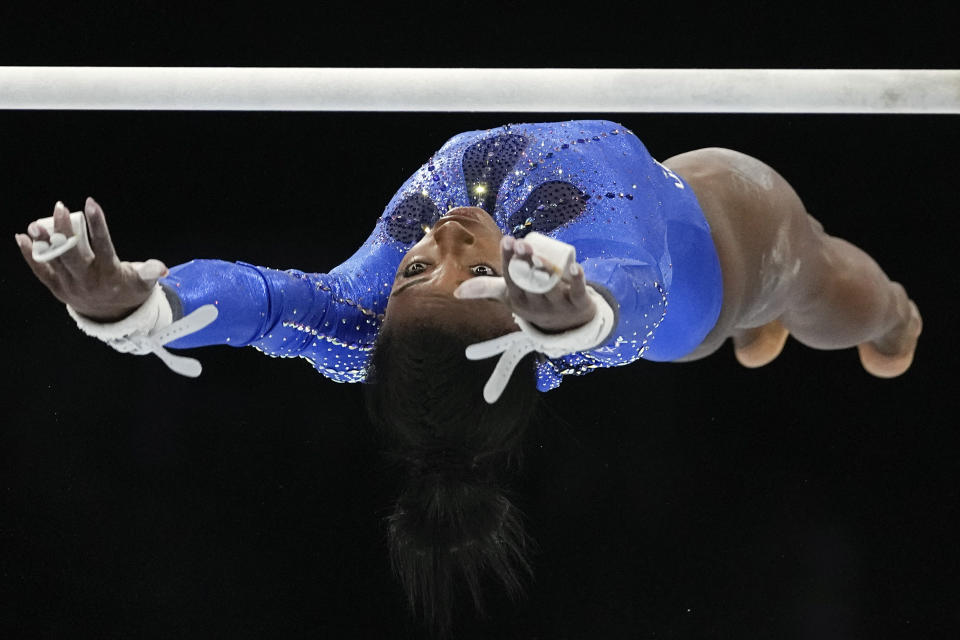 FILE - United States' Simone Biles competes in the uneven bars during the women's all-round final at the Artistic Gymnastics World Championships in Antwerp, Belgium, Friday, Oct. 6, 2023. Biles was named the AP Female Athlete of the Year for a third time on Friday, Dec. 22, 2023, after winning national and world all-around titles in her return to gymnastics following a two-year break after the Tokyo Olympics. (AP Photo/Virginia Mayo, File)