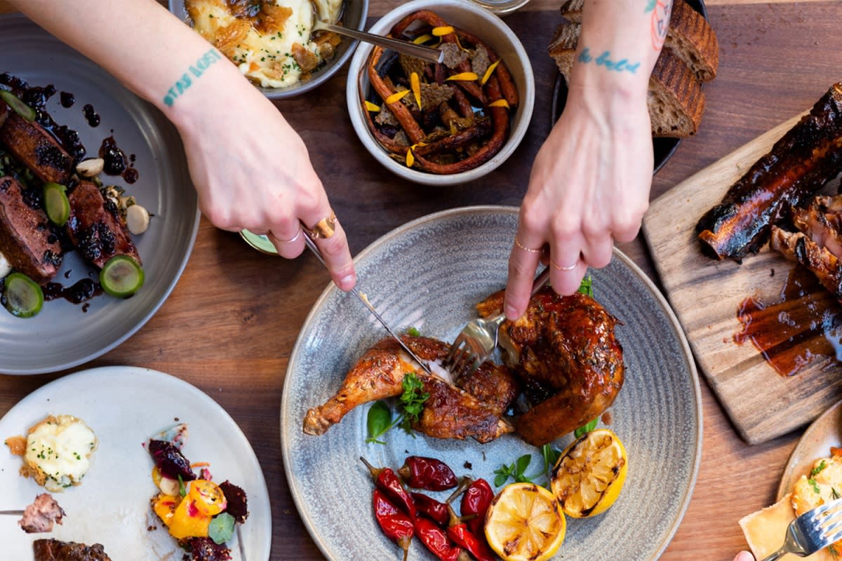 a model cutting into a meal