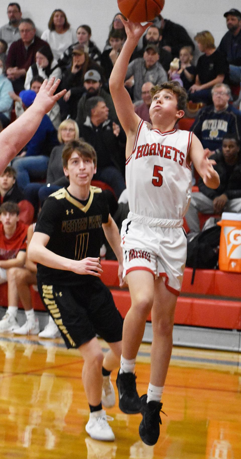 Jack Eisele (5) of Honesdale hits an acrobatic floater in the Hornets' first win of the season over Western Wayne.