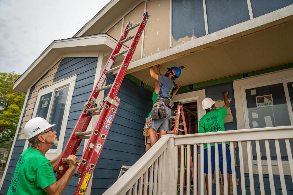 A team of Habitat for Humanity staff and volunteers works to build a home at the Iowa State Fair, Monday, Aug. 15, 2022.