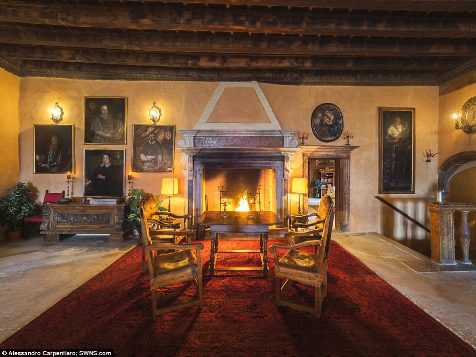 <p>This was likely one of the cozier spots in the castle before an electric generator and two heating system were recently installed. (Concierge Auctions) </p>