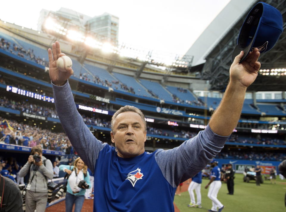 Toronto Blue Jays manager John Gibbons waves to fans after the team's 3-1 win over the Houston Astros in a baseball game Wednesday, Sept. 26, 2018, in Toronto. The Blue Jays announced the long-expected news that Gibbons would not be returning next season before their home finale. Toronto wraps up the season with a three-game road series against Tampa Bay this weekend. (Frank Gunn/The Canadian Press via AP)