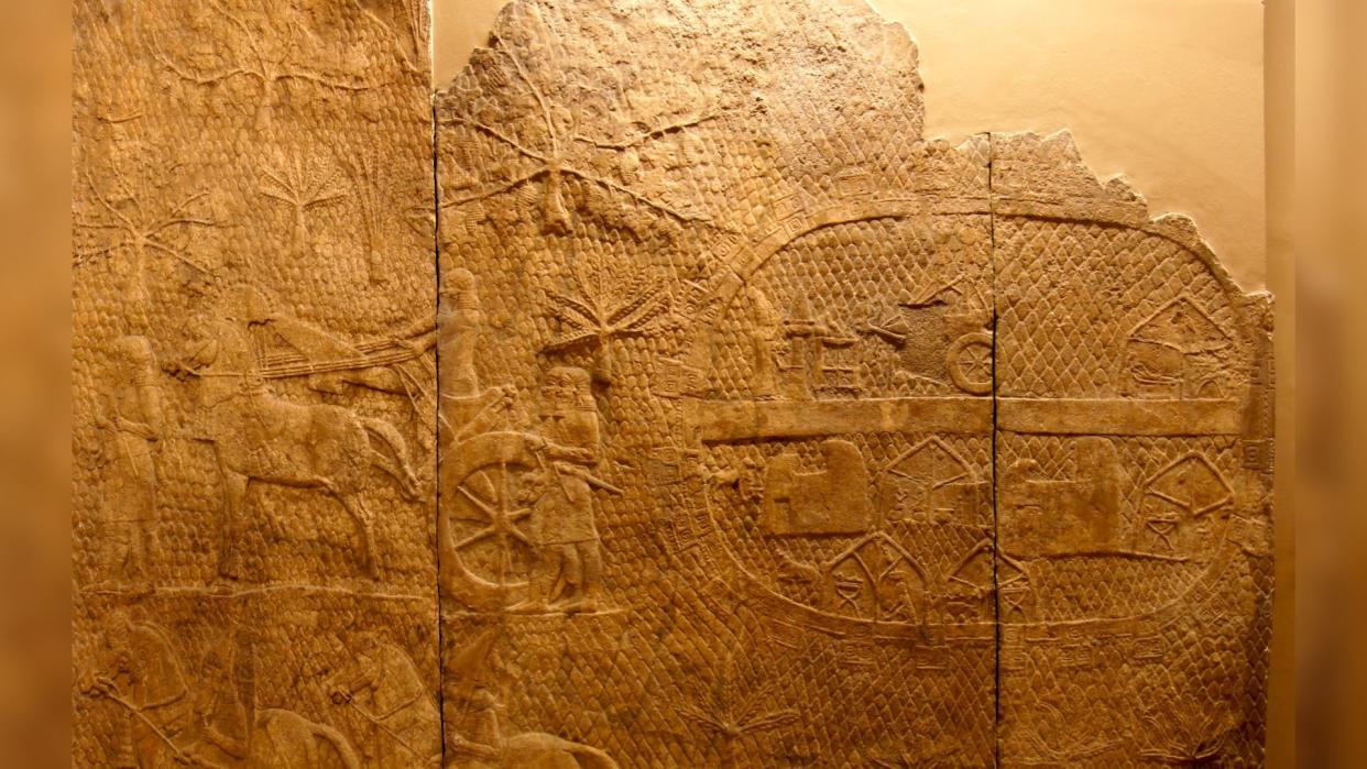  In this Assyrian relief, we see men on horses surrounding a city. 