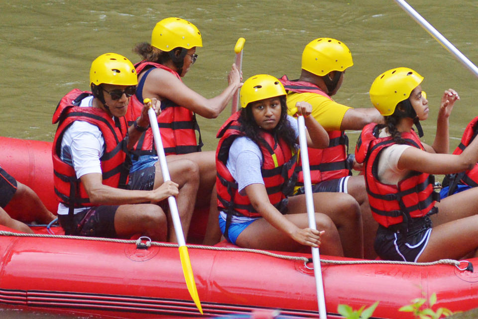 <p>And on one of his many Indonesian adventures, Obama rocked a life vest and yellow helmet. Safety first! </p>