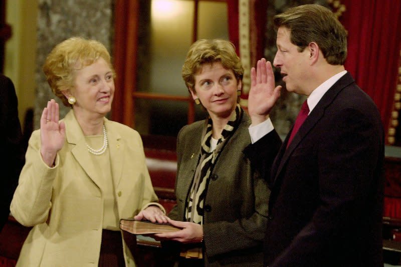 Former Missouri U.S. Senator and Missouri first lady Jean Carnahan shown in this file photo is sworn in to the Senate during a mock ceremony by Vice President Al Gore in Washington, D.C., on Jan. 3, 2001. Daughter Robin Carnahan is shown holding the bible. File Photo by UPI