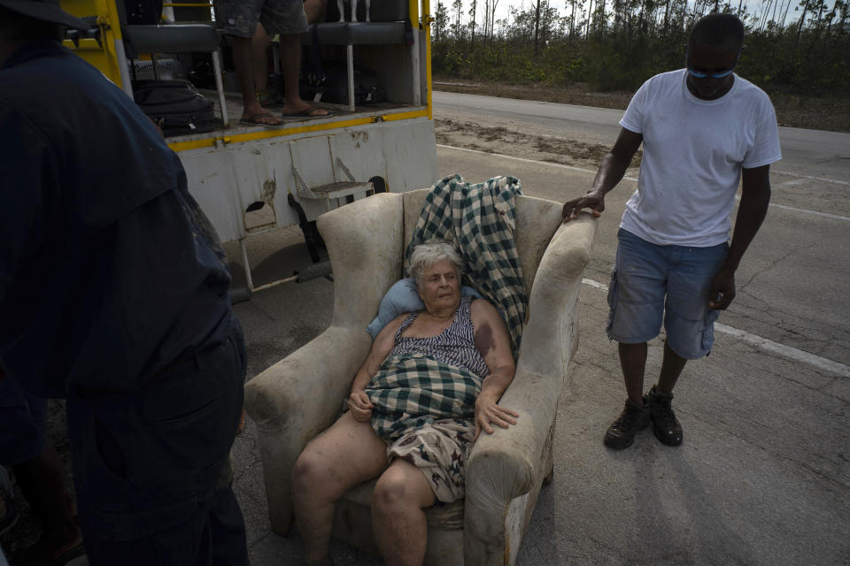 Virginia Mosvold sits on sits on a lounger after being rescued from her home, flooded by the waters of Hurricane Dorian, on the outskirts of Freeport, Bahamas, Wednesday, Sept. 4, 2019. The 84-year-old Mosvold was taken to a hospital in Freeport. Rescue crews in the Bahamas fanned out across a blasted landscape of smashed and flooded homes trying to reach drenched and stunned victims of Hurricane Dorian and take the full measure of the disaster. (AP Photo/Ramon Espinosa)