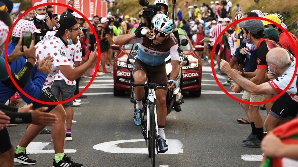 Teams and riders in the Tour de France have called for spectators to wear face masks properly and maintain distancing as fears the coronavirus could ruin the race grow. (Photo by ANNE-CHRISTINE POUJOULAT/AFP via Getty Images)