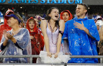 TAMPA, FL - JUNE 08: Fans of Team USA cheer on their team in the rain against Team Antigua and Barbuda during the FIFA World Cup Qualifier Match at Raymond James Stadium on June 8, 2012 in Tampa, Florida. (Photo by J. Meric/Getty Images)