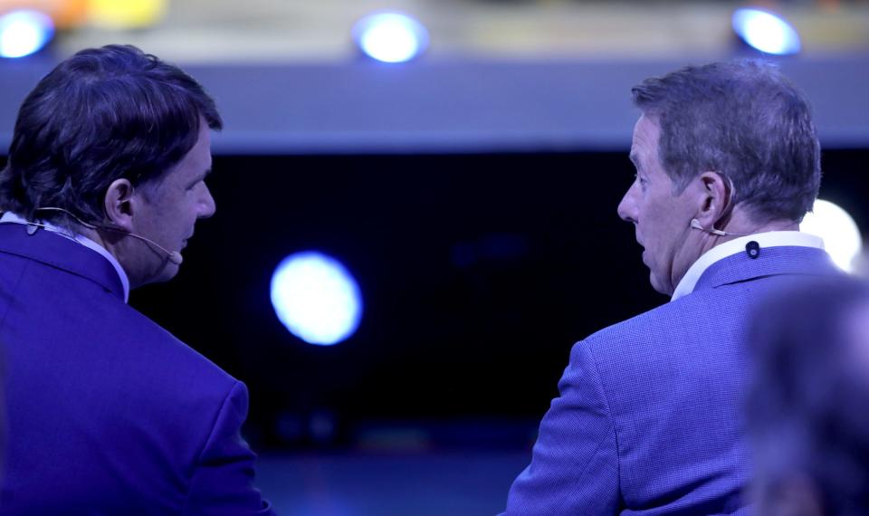 Jim Farley (left), the CEO of the Ford Motor Company, and Bill Ford, Ford's executive chair, talk before going on stage to talk about the F-150 Lightning pickup truck during its official launch at the Ford Rouge Electric Vehicle Center in Dearborn on Tuesday, April 26, 2022.