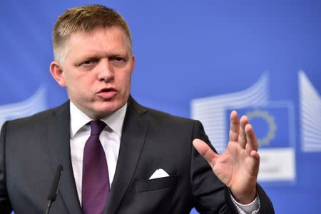 FILE PHOTO: Slovakia's Prime Minister Robert Fico and European Commission President Jean-Claude Juncker (not pictured) hold a news conference after a meeting at the European Commission in Brussels, Belgium July 27, 2017. REUTERS/Eric Vidal