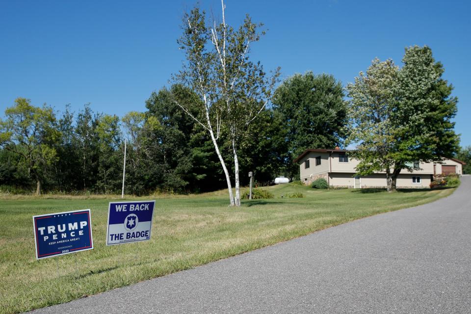 A sign supporting Donald Trump and Mike Pence is seen in Reedsburg, Wis., in 2020.