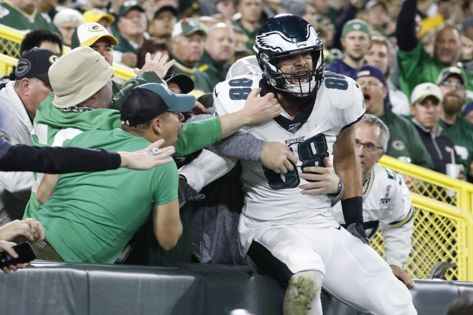 Philadelphia Eagles tight end Dallas Goedert celebrates with fans after scoring a touchdown during the first half of an NFL football game against the Green Bay Packers on Thursday, Sept. 26, 2019, in Green Bay, Wis. (AP Photo/Jeffrey Phelps)