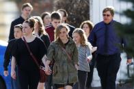 People arrive for the funeral of Jordan Segura in Calgary, Alberta April 21, 2014. Matthew de Grood has been charged with killing Segura and four of his friends at a house party last week in Calgary's worst mass murder in the history of the city, according to local media reports. REUTERS/Todd Korol (CANADA - Tags: CRIME LAW OBITUARY)