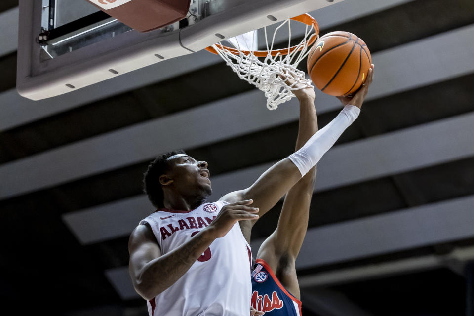 Alabama guard Jaden Bradley (0) gets past Mississippi guard Amaree Abram (1) for a shot during the second half of an NCAA college basketball game, Tuesday, Jan. 3, 2023, in Tuscaloosa, Ala. (AP Photo/Vasha Hunt)