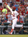 St. Louis Cardinals' Marcell Ozuna celebrates after hitting a solo home run during the second inning of the team's baseball game against the Washington Nationals on Wednesday, Aug. 15, 2018, in St. Louis. (AP Photo/Jeff Roberson)