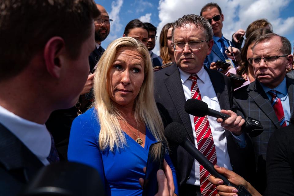 Rep. Marjorie Taylor Greene (R-GA) and Rep. Thomas Massie (R-KY) speak to members of the press on the steps of the House of Representatives after a meeting with Speaker of the House Mike Johnson (R-LA) at the U.S. Capitol on May 7, 2024 in Washington, DC (Getty Images)