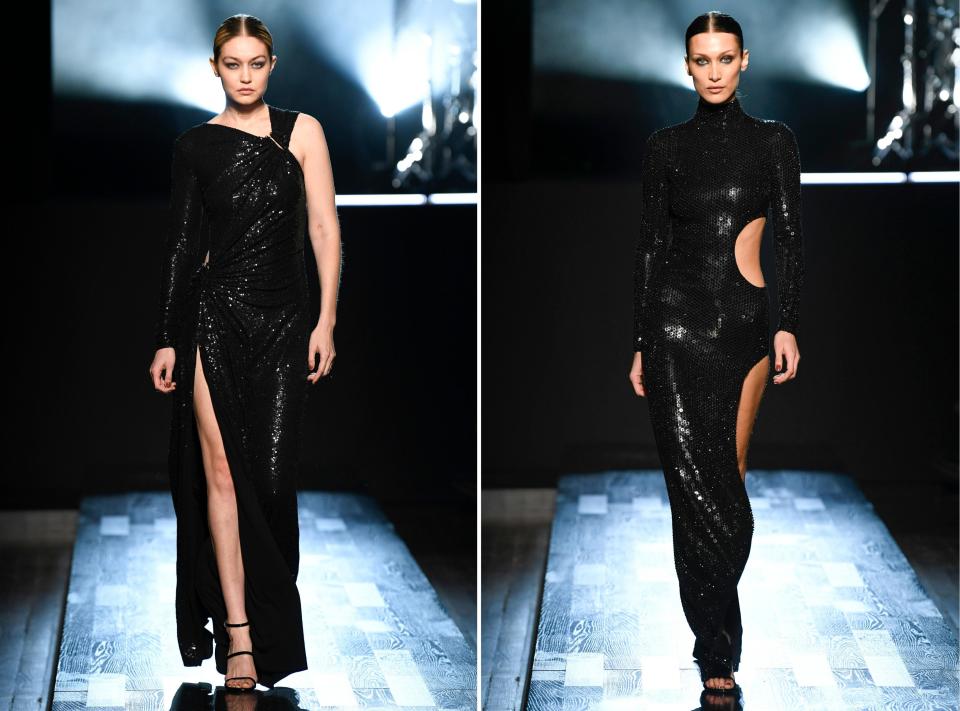 Gigi and Bella Hadid walk the runway during the Michael Kors Ready to Wear Fall/Winter 2022-2023 fashion show.