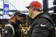 Pittsburgh Steelers head coach Mike Tomlin speaks with Atlanta Falcons head coach Arthur Smith after an NFL football game, Sunday, Dec. 4, 2022, in Atlanta. The Pittsburgh Steelers won 19-16. (AP Photo/Brynn Anderson)