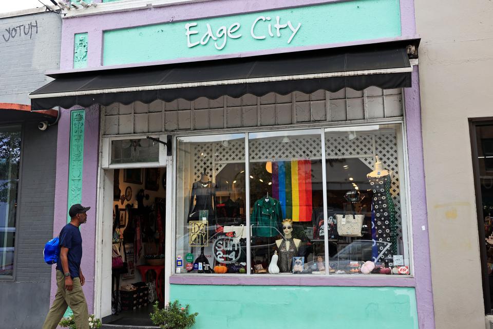 Robert Jackson peeks into the Edge City boutique in Five Points, Jacksonville. Longtime owner and operator Gunnel Humphreys is stepping aside for new owners in the new year.