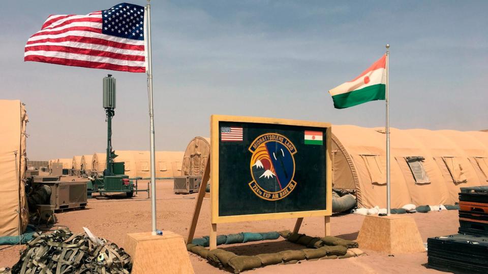PHOTO: In this file photo taken Monday, April 16, 2018, a U.S. and Niger flag are raised side by side at the base camp for air forces and other personnel supporting the construction of Niger Air Base 201 in Agadez, Niger.  (Carley Petesch/AP, FILE)