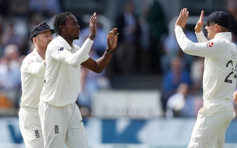 England's Jofra Archer, second left, celebrates after taking the wicket of Australia's Tim Paine - Credit: AP