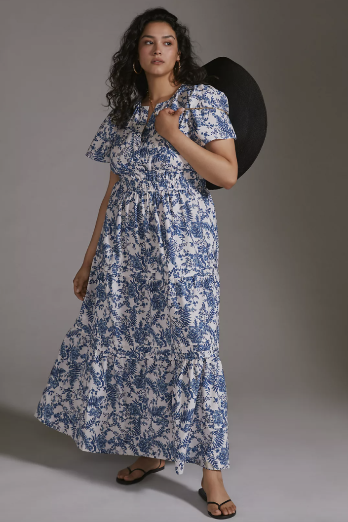 plus size model with brown curly hair in white and ivory floral maxi dress, The Somerset Maxi Dress in Ivory (Photo via Anthropologie), anthropologie dress