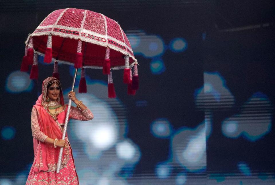 India’s Harnaaz Sandhu performs as she takes part in the National Costume portion of the Miss Universe pageant, in Eilat, Israel, Friday, Dec. 10, 2021. - Credit: AP