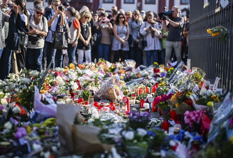 People attend a rally under the motto 'Mannheim sticks together' in Mannheim Germany, Monday, June 3, 2024.