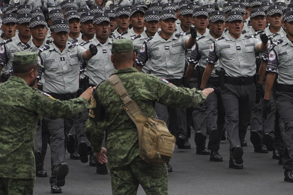 National Guards march in the anual Independence Day military parade in the capital's main square, the Zocalo, in Mexico City, on Friday, September 16, 2022. (AP Photo/Marco Ugarte)