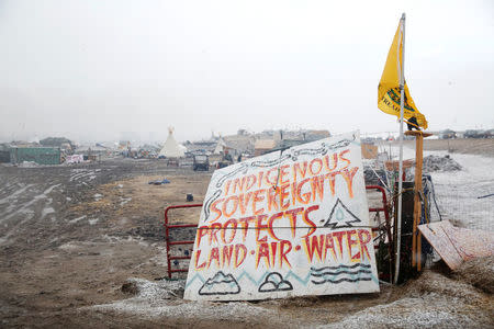 A sign stands in the entrance of the main opposition camp against the Dakota Access oil pipeline near Cannon Ball, North Dakota, U.S., February 22, 2017. REUTERS/Terray Sylvester