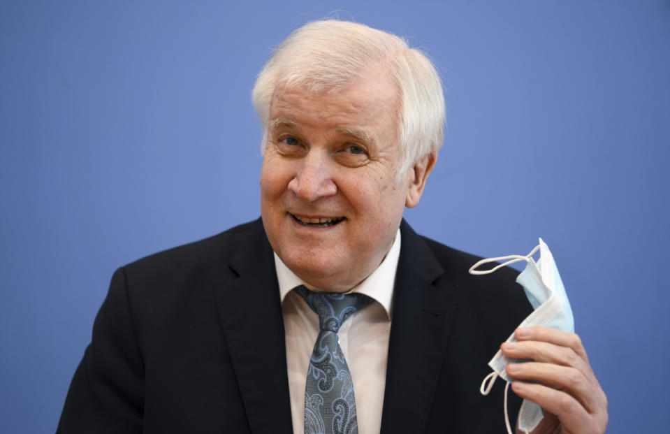 German Interior Minister Horst Seehofer attends a news conference about the crime statistics report for 2020 in Berlin, Germany, Thursday, April 15, 2021. (Annegret Hilse/Pool via AP)