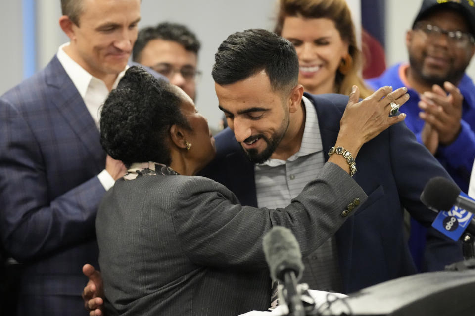 U.S. Rep. Sheila Jackson Lee, D-Texas, left, hugs Abdul Wasi Safi during a news conference Friday, Jan. 27, 2023, in Houston. Wasi Safi, an intelligence officer for the Afghan National Security Forces who fled Afghanistan following the withdrawal of U.S. forces, was freed this week and reunited with his brother after spending months in immigration detention. (AP Photo/David J. Phillip)