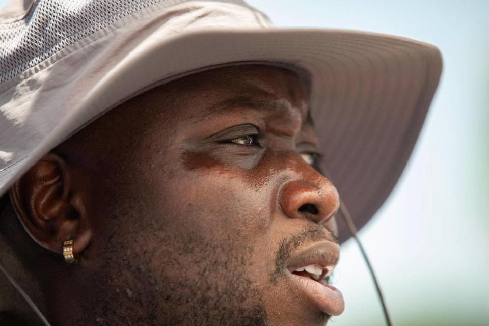 Alex Bailey sweats as he watches and films the actors performing a scene outside. “[The heat] can make for a draining day, but it’s just part of living down here,” Herman said. “So, you get used to it.” Lauren Witte/lwitte@miamiherald.com