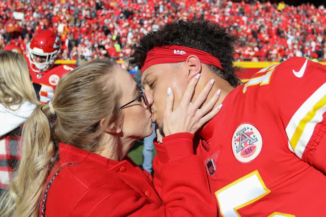 Scott Winters/Icon Sportswire via Getty Brittany and Patrick Mahomes kissing on the field