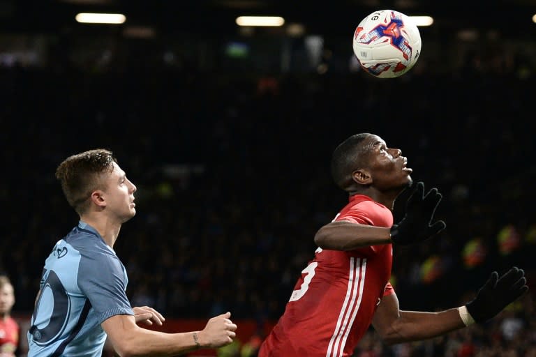 Manchester City's Pablo Maffeo (L) vies with Manchester United's Paul Pogba on October 26, 2016